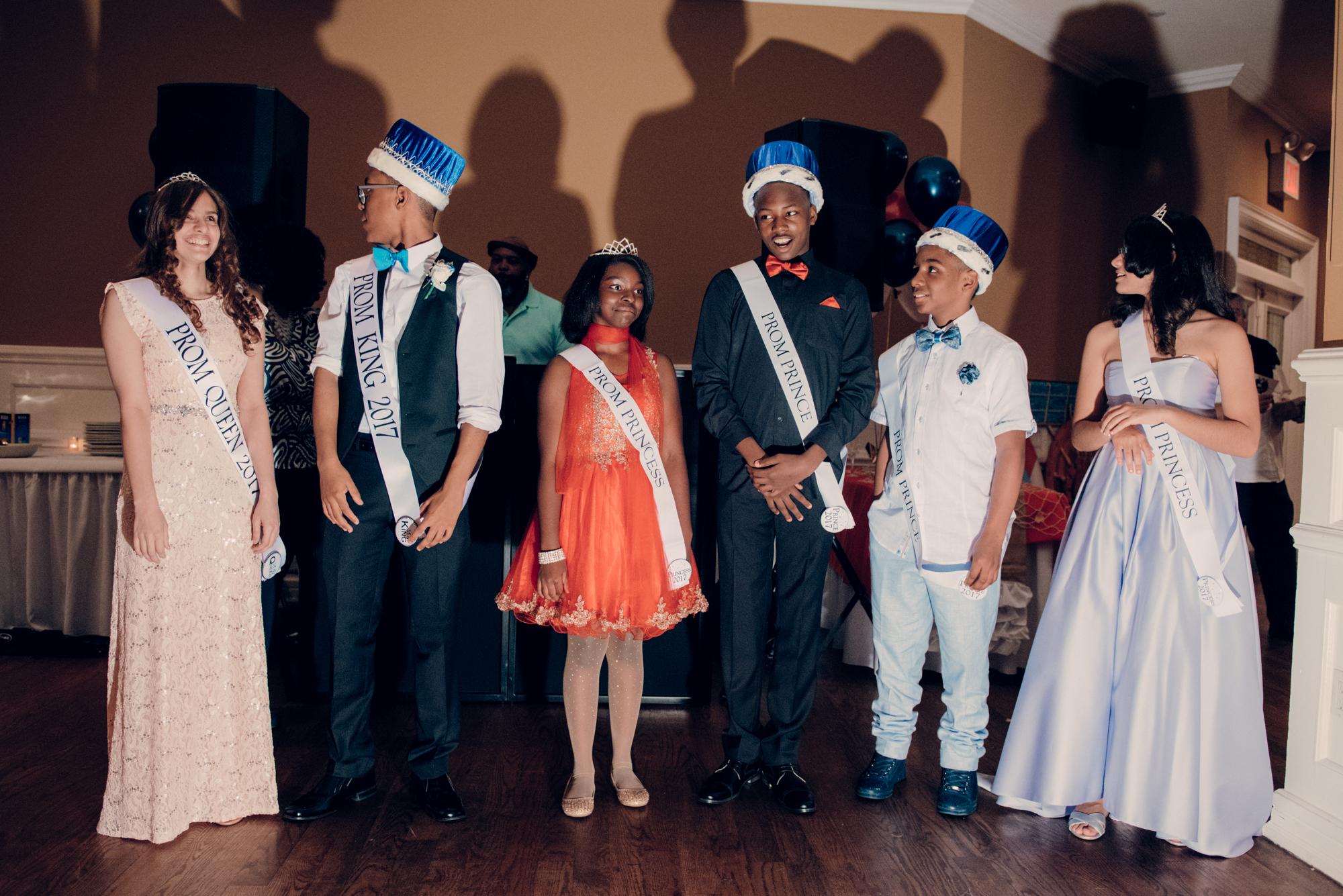 The prom king and queen with their court of 2 princesses and princes