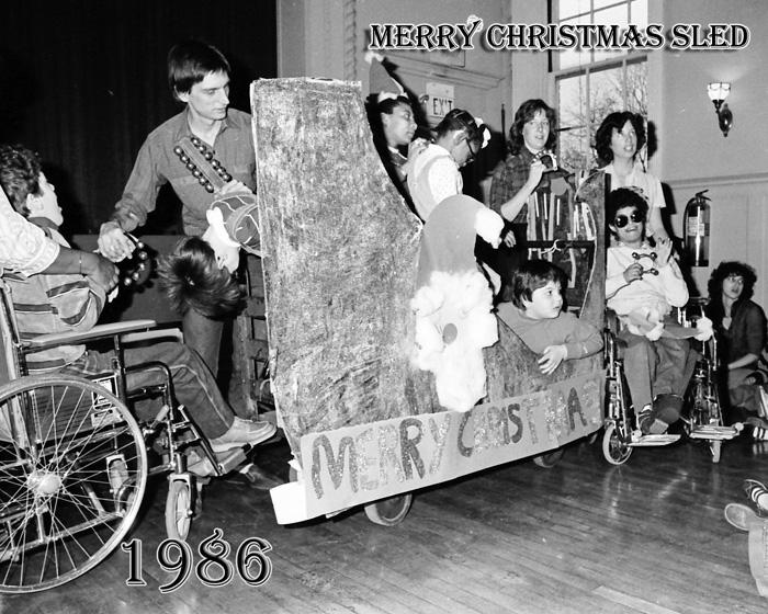 1986 Christmas show with Frampton Hall students in a rolling sled