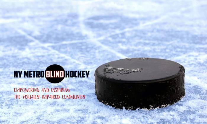 Image of a hockey puck on a skating rink with the logo of the NY Metro Blind Hockey. Words: Empowering and inspiring the visually impaired community. 
