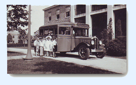 1931 Image of young students boarding school bus on a trip to the Bronx Zoo.