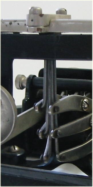 Closeup view of the braille producing  rods attached to the keys.