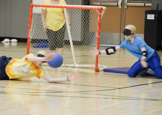 Campers learning about goalball