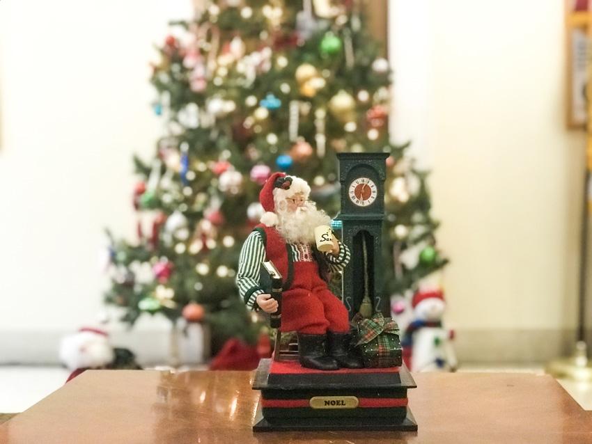 Santa enjoying his decorated tree