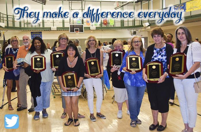 10 of the 30 year award staff with the words above "They Make a Difference Everyday"