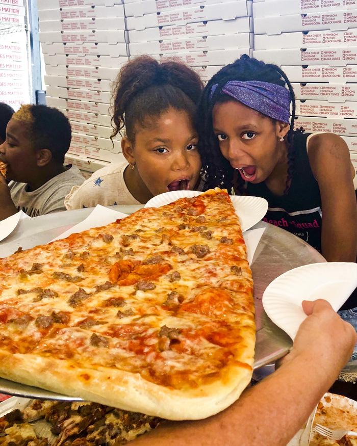Two VC girls getting ready to dig in to the super slice. 