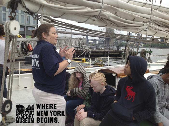 Students on the schooner listening to the instructor. 