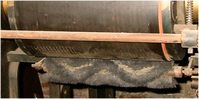 A view of the embossing plate with positive NY Point dots on the metal plate master. A hair brush roller kept the plate clean of paper debris.
