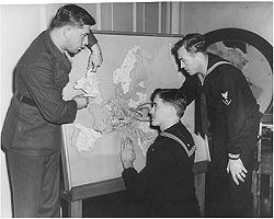 3 Navy Vets study Tactile map of Europe, Blinded Navy veterans were sent to NYI for rehabilitation during WWII